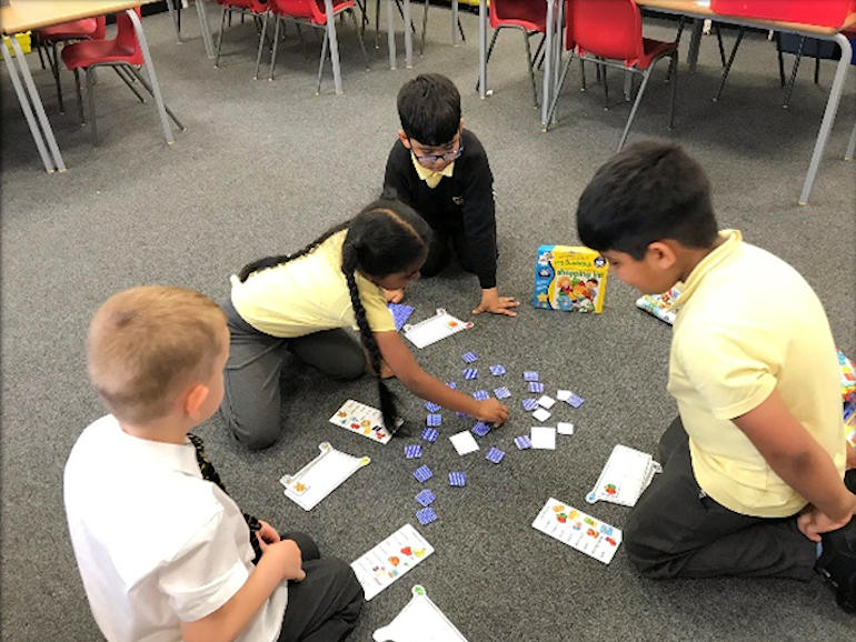 Children playing games together in a circle