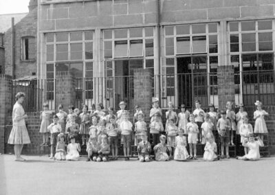 Children playing percussion instruments, year unknown