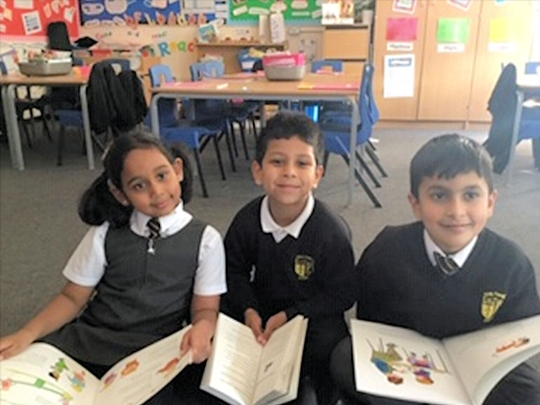 Three children with reading books